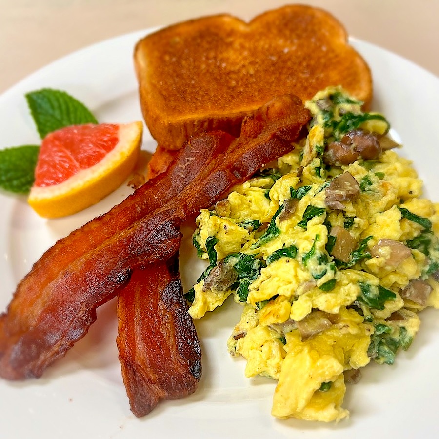 Eggs scrambled with spinach, mushrooms and Monterey Jack, applewood bacon
