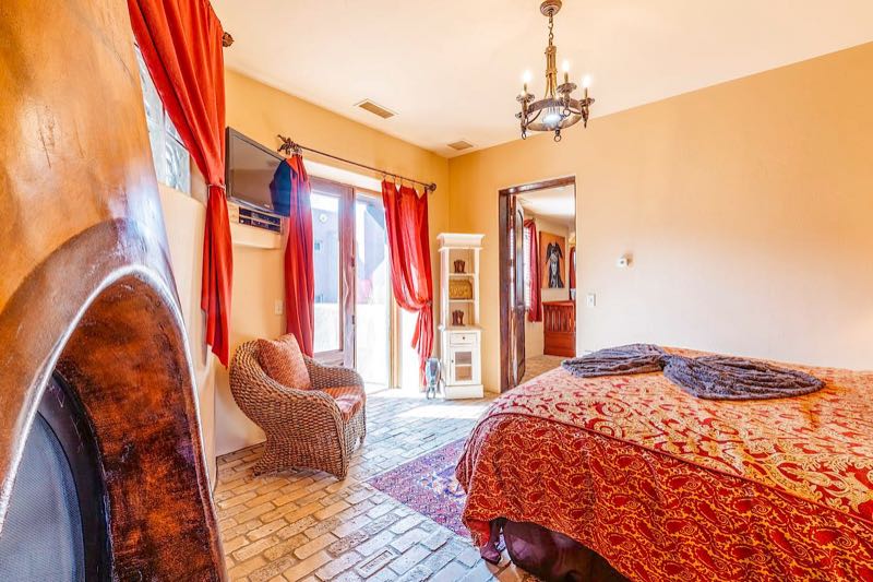 Hacienda villa second bedroom with an arched doorway