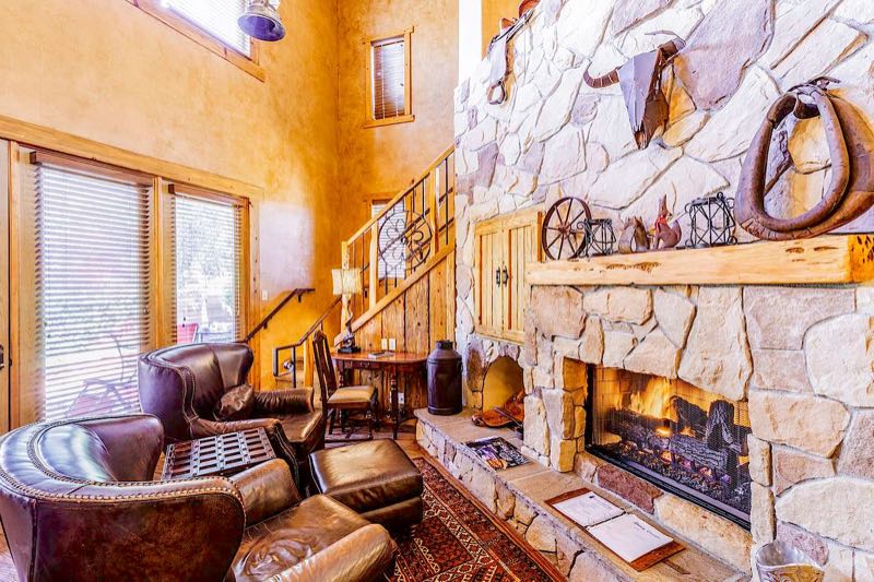 Silver Spur villa stone fireplace and the stairs to the loft