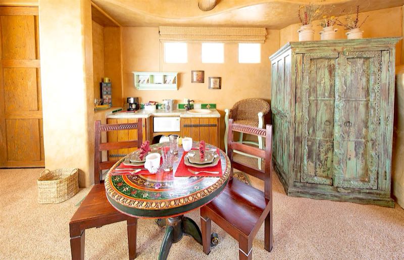 Twin Kyody villa kitchenette with a painted table and armoire